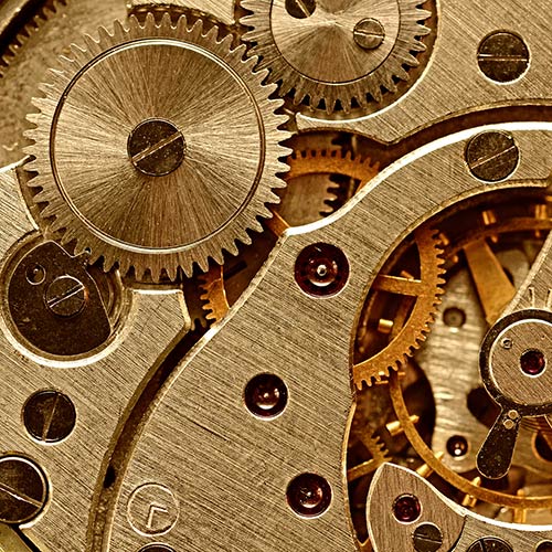 A closeup of gears inside a clock