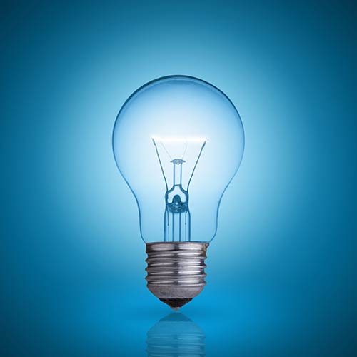 A lightbulb in front of a blue background