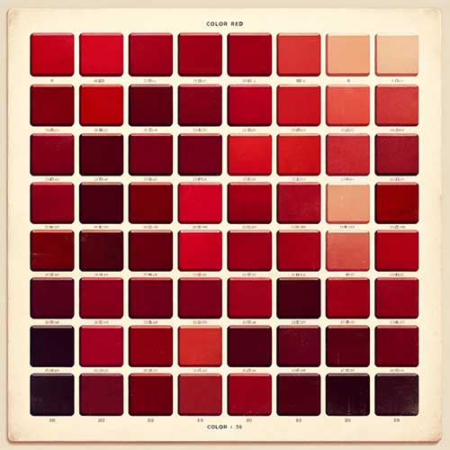A grid of paint swatches in various shades of red